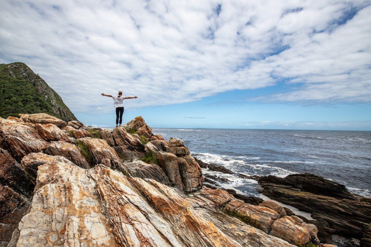 woman standing on rock